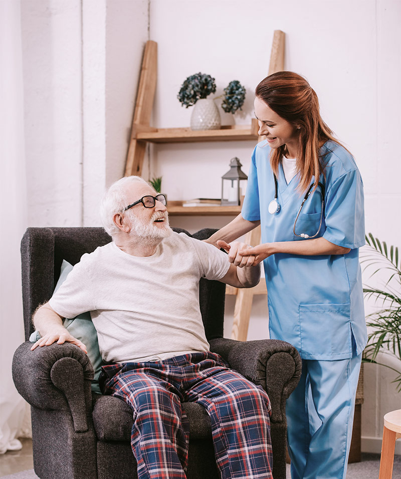 Elderly man with a caregiver. Frequently asked questions. Home Care